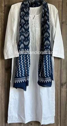 "Cool and comfy pure cotton White Kurti accompanied by 'Dabu' hand printed pure cotton Indigo stole. Team it with Chikankari leggings or a palazzo for a stylish look ! Kurti Length:46 inches Stole : 22 in by 68 in Inner included \"DESIGNS MAY VARY\" MORE COLOURS/DESIGNS/SIZES AVAILABLE. DROP US A MESSAGE ON ETSY CHAT FOR MORE OPTIONS" Dabu Print Kurti Design, White Kurti Outfit, White Kurta Outfits Women, Kurti With Scarf, White Kurti Designs, White Chikankari Kurta, White Kurti, Indigo Dress, Chikankari Kurta