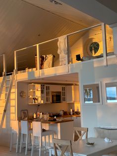 a loft bed is built into the side of a house with stairs leading up to it