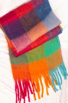 A cosy voluminous scarf in a super soft wool blend material, to keep you extra cosy this winter. Fringe detailing on the ends of the scarf. Warm tones of blue pink, and orange make an accent in a classic plaid print pattern scarf.  Cosy Plaid print Fringe details Large size Super soft feel Plaid Print Pattern, Colourful Scarf, Striped Shawl, Rainbow Scarf, Pattern Scarf, Chunky Scarves, Rose Bleu, Bright Stripes, Colorful Scarf