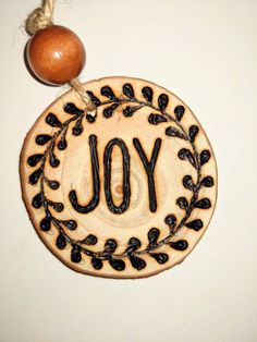 a wooden ornament with the word you on it