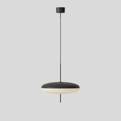 a black and white pendant light hanging from a gray ceiling with two lights on each side