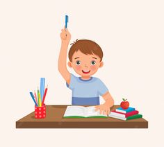 a little boy sitting at a desk with an open book and pointing to the sky