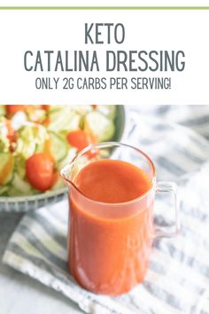 homemade catalina dressing in a glass pitcher next to a plate with salad and cucumbers