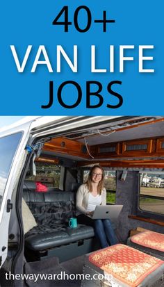 a woman sitting in the back of a van working on her laptop