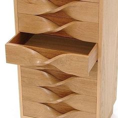 a wooden drawer with three drawers on each side and an open drawer in the middle