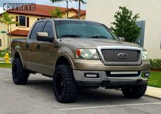 a brown truck parked in a parking lot