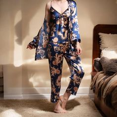 Crafted from smooth, high-quality materials, this set features a beautiful dragon print in a rich colorway. The set includes a camisole top, pants, and a matching robe for a truly opulent sleepwear experience. Size: - XS, S, M, L, XL (Please check the size chart) Materials: -  Satin, Polyester Honeymoon Sleepwear, Satin Pyjama, Bridal Pajamas, Silk Pajamas Women, Pyjama Satin, Matching Robes, Silk Pajama, Silk Satin Fabric, Beautiful Dragon