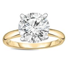 a yellow gold engagement ring with a round cut diamond in the center, on a white background