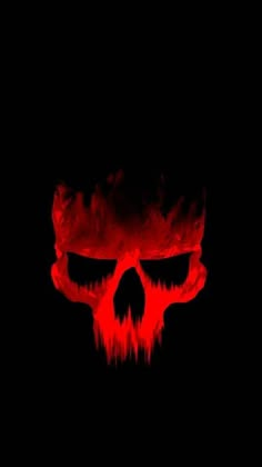 a red skull with flames on it's face is shown in the middle of a black background