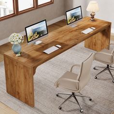 an office desk with two computer monitors on top of it and chairs in front of the desk