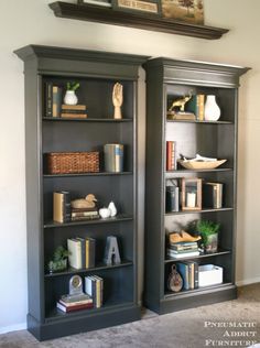 two bookshelves with different types of books on them in the corner of a room