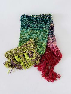 multicolored scarf laying on top of each other