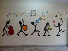 the wall is painted with musical instruments and music notes on it, along with an image of people