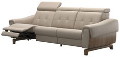 a beige leather reclining sofa sitting on top of a wooden frame