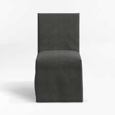 a dark colored chair sitting on top of a white floor