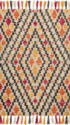 an old rug with different colors and patterns on the side, including black, white, orange