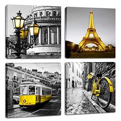 four black and white pictures of the eiffel tower in paris, including a yellow trolley