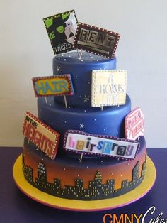 a three tiered cake with signs on it