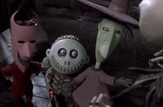 three animated characters dressed in halloween costumes, one with a creepy face and the other wearing a top hat