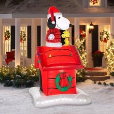 a large inflatable dog house with christmas decorations