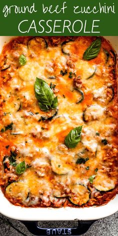 a casserole dish with meat, cheese and spinach