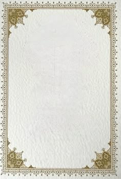 a white and gold paper with an ornate border on it's edges is shown