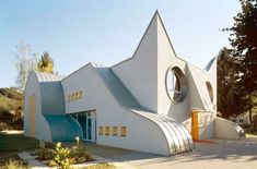 a white church with curved windows on the side