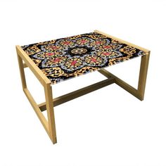 a wooden table with an intricate design on it's top and bottom edge, against a white background