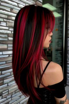 Mesmerizing Blue Highlights for a Bold Look Red And Pink Highlights On Dark Hair, Black Hair Magenta Highlights, Black And Red Streaks Hair, Red Highlights In Brown Hair Wolfcut, Red And Dark Hair, Brown Hair With Bright Red Highlights, Skunk Highlights Red, Dark Red Chunky Highlights