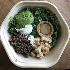 a white bowl filled with different types of food