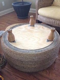 a living room with two wicker chairs and a round coffee table in the middle