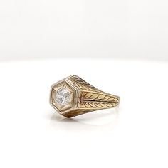 This is part of Chairish’s Fine Jewelry assortment.  A very fine antique engraved 14k gold and diamond ring.  With a lovely ca. 0.24 ct. Old European cut diamond (Color: G /Clarity: I1) set at the center of a hexagonal setting that is engraved with a feathered design to the band and shoulders.  Accompanied by a GEMLAB (Gemological Appraisal Laboratory) report.   Simply a wonderful ring!  Date: 20th Century  Overall Condition: It is in overall good, as-pictured, used estate condition with some ve European Cut Diamond Ring, European Cut Diamonds, Filigree Ring, Diamond Color, Antique Rings, Unique Rings, Colored Diamonds, The Band, Gold Diamond