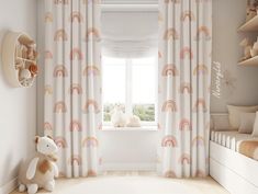 a child's room with white curtains and rainbows