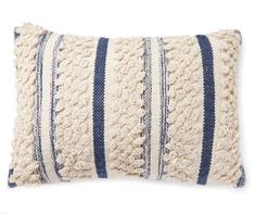 a white and blue striped pillow on a white background