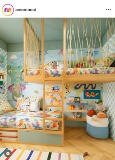 a child's bedroom with bunk beds and colorful wallpapers on the walls