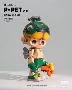 a small toy figurine with a green helmet and yellow pants holding a tool