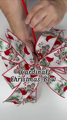 someone is making a christmas bow with red and white ribbons on it, while the words canadian christmas bow are written below