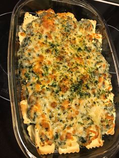 a casserole dish with broccoli and cheese