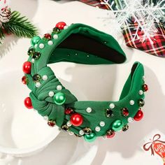 This fabric headband is bejeweled with accent rhinestones in Christmas colors with a top knot accent. Perfect for any holiday party! Green Headband, Jeweled Headband, Christmas Headband, Fabric Headbands, Hair Accessories Gift, White Headband, Christmas Accessories, Pearl Headband, Knot Headband