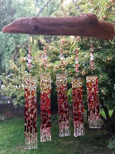 a wind chime hanging from a tree branch