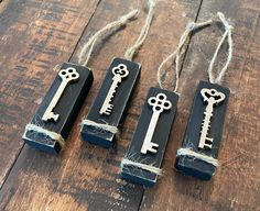 three pieces of wood that have been made to look like keys