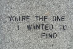 the words you're the one i wanted to find written on concrete