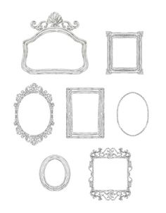 an assortment of silver frames and ornaments