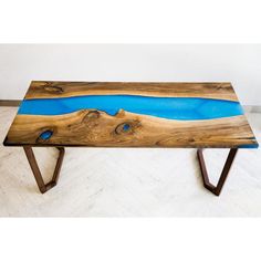 a wooden table with blue paint on it