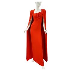 Tom Ford Venetian Red Silk-Georgette Evening Cape Dress Italian size - 38 F/W 2023 Collection TOM FORD's Fall '23 collection was the founder's swan song before stepping down, highlighting some of his hero designs from the past 13 years. A redux of a style from 2012, this beautiful cape is cut from silk-georgette in a clean, flowing silhouette. This gown is based on the style Gwyneth Paltrow wore to the 2012 Oscars. Cut from silk-georgette, it has a draped asymmetric neckline and figure-skimming fit that reaches the floor. Designed for a slim fit, Internal shoulder pads, Mid-weight, Stretchy fabric, Zip fastening at back. Measurements: Length - 62 inches, Bust - 30/32", Waist - 25", Hips - 32/34". Made in Italy. New with tag. Red Formal Dress With Cape Sleeves, Red Cape Sleeve Dress For Evening, Red Fitted Dress With Cape Sleeves, Tom Ford Dress, Dress Italian, Cape Fashion, Italian Dress, Swan Song, Designer Evening Dresses