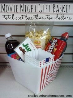 the movie night gift basket is filled with snacks and other items to make it memorable