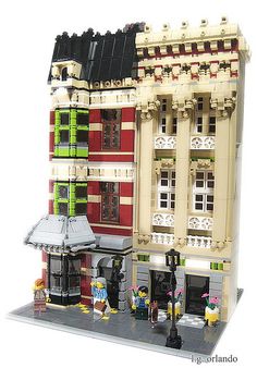 a lego model of a building with people standing outside