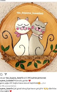 two cats sitting on top of a wooden slice with leaves around it and the caption says, tas, bovana, kusadas