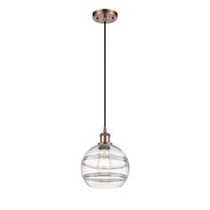 a glass globe light hanging from the ceiling