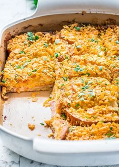 a casserole dish with meat and cheese in it on a white counter top